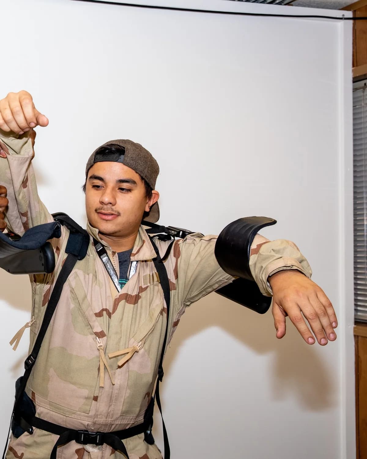 A worker being fitted with the Levitate AIRFRAME upper-limb exoskeleton.