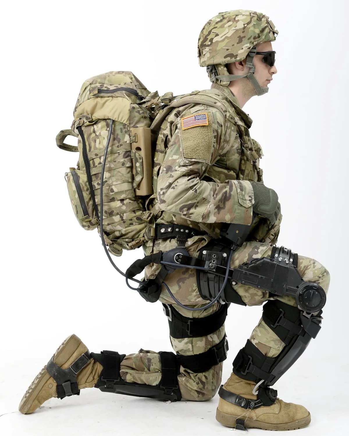 A soldier kneeling in the Lockheed Martin ONYX powered exoskeleton.